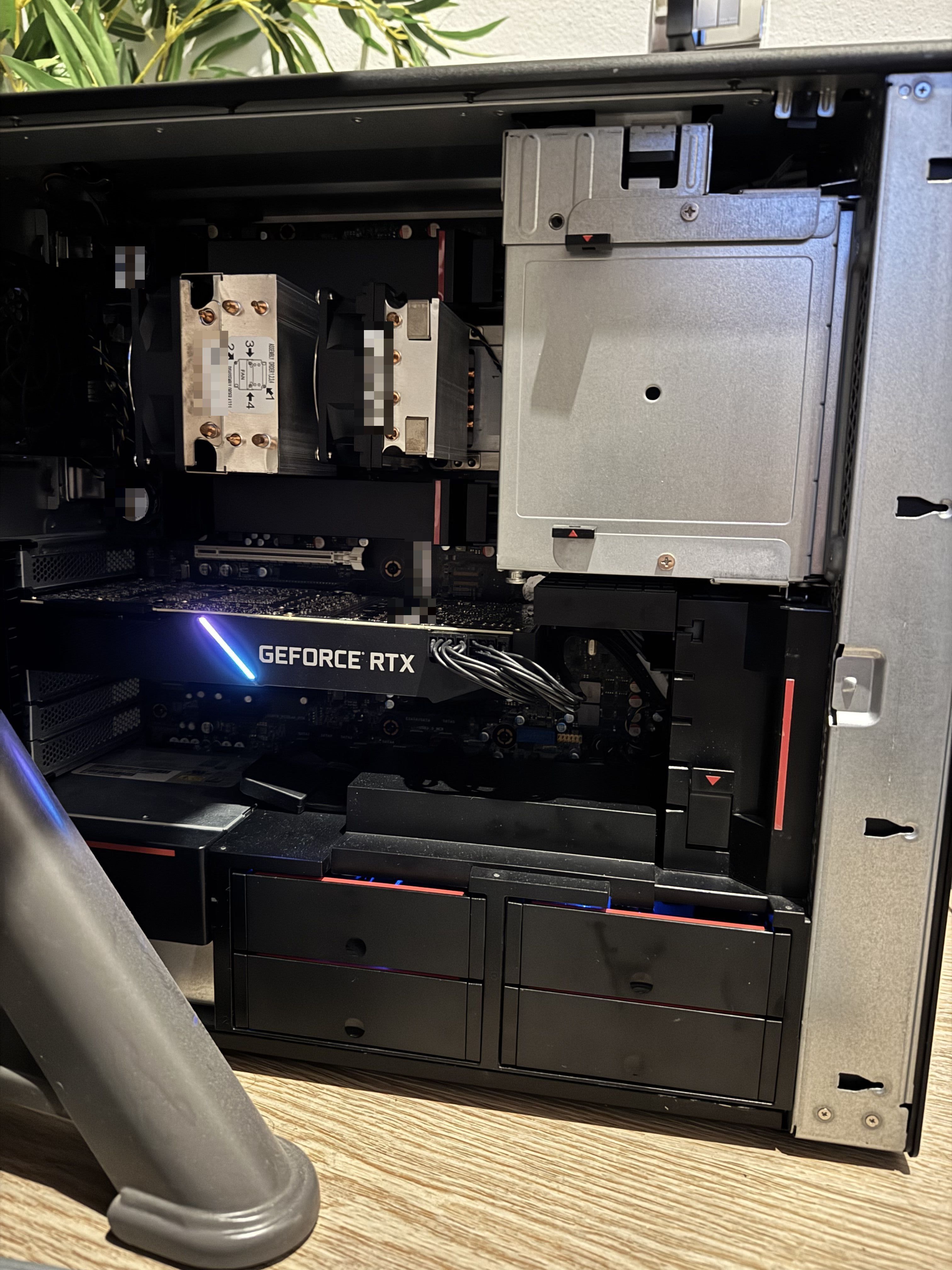 Refurbished Lenovo ThinkStation P720 with the side panel open, showing the two Xeon CPU coolers, an RTX graphics card and the drive bays